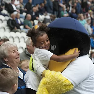 Deepdale Duck And Young Fan Share A Hug