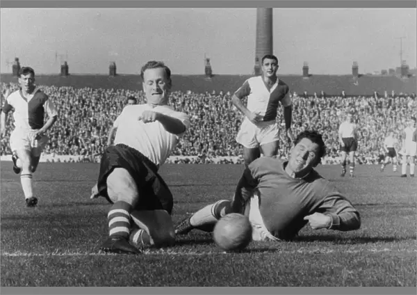 Soccer. Tom Finney, Preston North End squeezes the ball past Adam Blacklaw