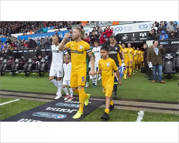 Skipper Tom Clarke Leads The Team Out At Swansea