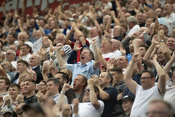 Joy For PNE Fans. PNE Fans celebrate as they you ahead against local rivals