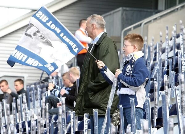 Preston North End vs Blackpool: Fans Honor Sir Tom Finney with Flag Wave at Deepdale (08 / 09)