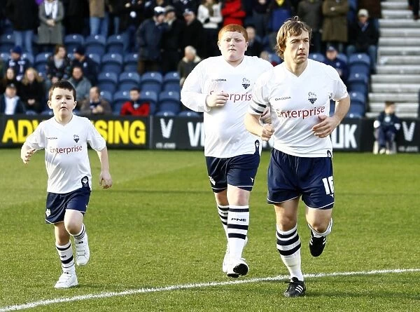 Preston North End vs Burnley: Paul McKenna and Mascots in Championship Action, 2009 - Deepdale
