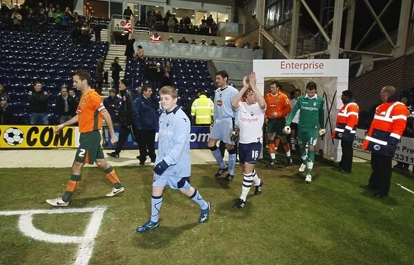 Preston North End vs Plymouth Argyle: Paul McKenna and the Mascot in Championship Action, 2009 - A Football Moment