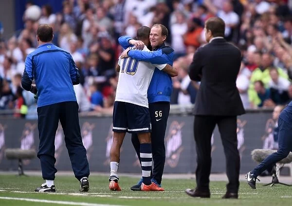 Preston North End's Jermaine Beckford Embraces Manager Simon Grayson in Euphoric Play-Off Final Victory