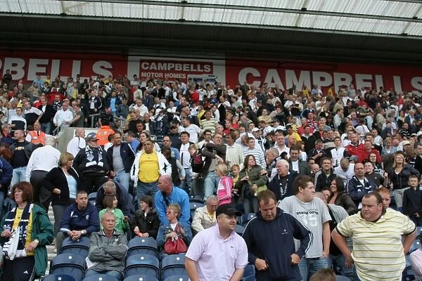 A Sea of Passion: Preston North End FC Fans in Action at PNE vs. Colchester United (25-08-07)