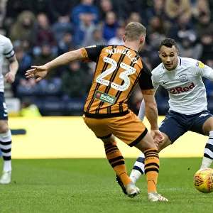 Graham Burke Takes On A Hull City Player At Deepdale