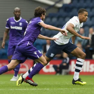 PNEs Lukas Nmecha taking on Joe Allen of Stoke City