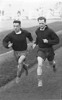 Sir Tom Finney Collection: Sir Tom Finney and Willie Cunningham Warm Up
